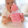 Picture of Dr. Brown's Milestones Wide-Neck Sippy Straw Bottle with 100% Silicone Handles and Weighted Straw, 9 oz/270 mL, Pink, 6m+