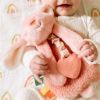 Picture of Itzy Ritzy - Itzy Lovey Including Teether - Baby Lovey with Teether, Textured Ribbons & Dangle Arms - Features Crinkle Sound, Sherpa Fabric and Minky Plush (Pink Bunny)
