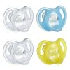Picture of Tommee Tippee Ultra-Light Silicone Pacifier, 6-18 Months, Symmetrical One-Piece Design, BPA-Free Silicone Binkies, Clear/Blue/Yellow, Pack of 4