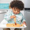 Picture of Bumkins Sleeved Bib for Girl or Boy, Baby and Toddler for 6-24 Mos, Essential Must Have for Eating, Feeding, Baby Led Weaning Supplies, Long Sleeve Mess Saving Food Catcher, Fabric, Dinosaur Gray