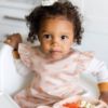Picture of Tiny Twinkle Mess Proof Baby Bib - Waterproof & Lightweight Baby-Led Weaning Apron | 100% Recycled Polyester, Easy Clean & Machine Washable (Boho Rainbow, Large 2-4 Years)