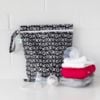 Picture of Bumkins Waterproof Wet Bag for Baby, Travel, Swim Suit, Cloth Diapers, Pump Parts, Pool, Gym Clothes, Toiletry, Strap to Stroller, Daycare, Zipper Reusable Bag, Wetdry Packing Pouch, XOXO Black