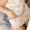 Picture of Tiny Twinkle Mess Proof Baby Bib - Waterproof Baby Apron - Machine Washable - PVC, BPA, & Phthalate Free - Great Travel Bib for Baby Eating - Baby Food Bibs (Cowboy, Small 6-24 Months)