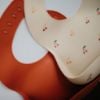 Picture of mushie Silicone Baby Bib | Adjustable Fit Waterproof Bibs (Cherries)
