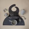 Picture of mushie Silicone Baby Bib | Adjustable Fit Waterproof Bibs (Planets)