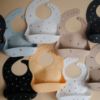Picture of mushie Silicone Baby Bib | Adjustable Fit Waterproof Bibs (Numbers Black)