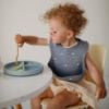 Picture of mushie Silicone Baby Bib | Adjustable Fit Waterproof Bibs (Boats)