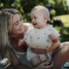 Picture of mushie Silicone Baby Bib | Adjustable Fit Waterproof Bibs (Rainbows)