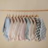 Picture of mushie Long Sleeve Baby Bib | Mess Free & Waterproof Fabric for Toddlers | Adjustable Fit for Ages 6-24 Months (Olive Check)