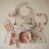 Picture of mushie Silicone Baby Bib | Adjustable Fit Waterproof Bibs (Lilac Flowers)