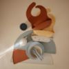 Picture of mushie Silicone Baby Bib | Adjustable Fit Waterproof Bibs (Clay)