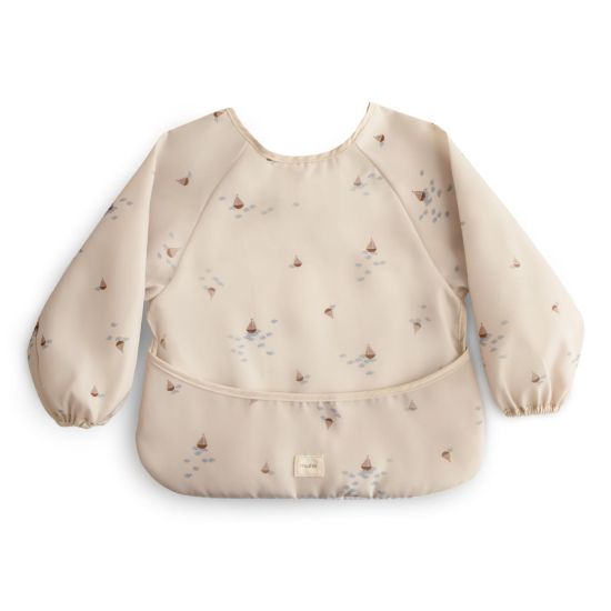 Picture of mushie Long Sleeve Baby Bib | Mess Free & Waterproof Fabric for Toddlers | Adjustable Fit for Ages 6-24 Months (Boats)