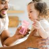Picture of The First Years Squeeze & Sip Toddler Straw Cups - Squeezable Transition Sippy Cup with Silicone Straw - Toddler Feeding Supplies - Pink/Purple/Blue - 7 Oz - 3 Count - Ages 6 Months and Up