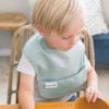 Picture of Tiny Twinkle Mess-Proof Baby Bib - Waterproof Bib for Baby Boy or Girl - Machine Washable - Adjustable Closure- PVC, BPA, & Phthalate Free - Great for Travel - Baby Food Bibs (3 Pack, Sage, Charcoal)