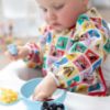 Picture of Bumkins Disney Sleeved Bib for Girl or Boy, Baby and Toddler for 6-24 Mos, Essential Must Have for Eating, Feeding, Baby Led Weaning Supplies, Long Sleeve Mess Saving, Mickey and Friends Check Mates