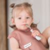 Picture of Tiny Twinkle Mess-Proof Baby Bib - Waterproof Bib for Baby Girl - Machine Washable - Adjustable Closure - PVC BPA & Phthalate Free -Great for Travel - Baby Food Bibs (3 Pack, Taupe, Dandelion)