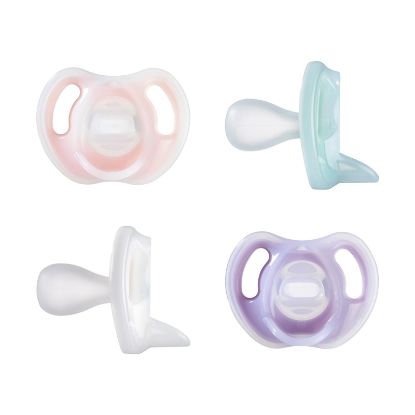 Picture of Tommee Tippee Ultra-Light Silicone Pacifier, 0-6 Months, Symmetrical One-Piece Design, BPA-Free Silicone Binkies, Pink/Purple/Green, Pack of 4