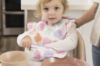 Picture of Tiny Twinkle Mess-Proof Baby Bib - Waterproof Bib for Baby Girl - Machine Washable - Adjustable Closure - PVC, BPA, & Phthalate Free - Great for Travel - Baby Food Bibs (3 Pack, Floral Pop)