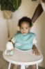 Picture of Tiny Twinkle Mess-Proof Baby Bib - Waterproof Bib for Baby Girl - Machine Washable - Adjustable Closure - PVC, BPA, & Phthalate Free - Great for Travel - Baby Food Bibs (3 Pack, Peace)