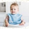Picture of Tiny Twinkle Mess-Proof Baby Bib - Waterproof Bib for Baby Boy or Girl - Machine Washable - Adjustable Closure - PVC, BPA & Phthalate Free - Great for Travel - Baby Food Bibs (5 Pack, Boy Solids)