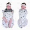 Picture of Happiest Baby Sleepea 5-Second Swaddle - 100% Organic Cotton Baby Swaddle Blanket - Doctor Designed Promotes Healthy Hip Development (Ivory Planets, Small)