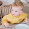 Picture of Tiny Twinkle Mess Proof Baby Bib, 2 Pack Long Sleeve Bib Outfit, Waterproof Bibs for Toddlers, Machine Washable, Tug Proof (Taupe Dandelion, Large 2-4 Years)