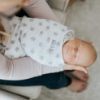 Picture of HALO 100% Cotton Sleepsack Swaddle, 3-Way Adjustable Wearable Blanket, TOG 1.5, Lamb Scribble White, Small, 3-6 Months