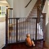 Picture of BABELIO Baby Gate with Black Wood Pattern, 29-48 Inch Auto Close Dog Gate for The House, Stairs and Doorways, Pressure Mounted Pet Gate with Door and Y Spindle Rods