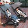Picture of UPPAbaby Minu Duo Side-by-Side Double Stroller - Lightweight + Compact Design for Travel - Easy Fold- From Birth to Toddler - Independent Recline -Greyson(Charcoal Mlange/Carbon Frame/Saddle Leather)