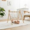 Picture of Comfy Cubs Wooden Baby Play Gym - Natural Finish Pinewood Baby Activity Gym with 5 Sensory Hanging Toys - Easy No-Tool Assembly, Safe and Durable for Infant Motor and Visual Development - Natural Wood