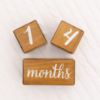Picture of Pondering Pine Baby Milestone Blocks - Natural Brown Stain Pine Wood with Weeks Months Years Grade and Holidays, Newborn Weekly Monthly First Year Picture Props, 6 Block Milestones Age Set with Bag